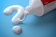 Toothpaste in the shape of question mark coming out from toothpaste tube. Brushing teeth dental concept.