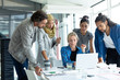 © WavebreakMediaMicro - Business people working together on laptop at conference room in a modern office