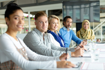 Business people looking at the camera during a business meeting in a modern office 