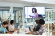 © WavebreakMediaMicro - Business people attending video conference at conference room in a modern office