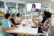 © WavebreakMediaMicro - Business people attending video conference at conference room in a modern office
