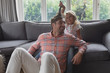 © WavebreakMediaMicro - Father and daughter playing together in living room