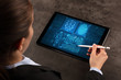 © ra2 studio - Business woman making analyses and checking fingerprints on tablet