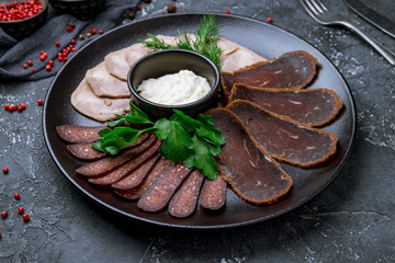 Sticker - slicing of different meat on black plate