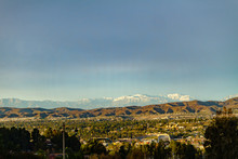 Snow Capped Mountains Above The Hills Of Anaheim California.