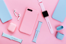 Up To Date Technology.Top View Of Diverse Personal Accessory Laying On The Pink Background