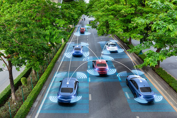 Smart cars with automatic sensor driving on green road with wireless connection