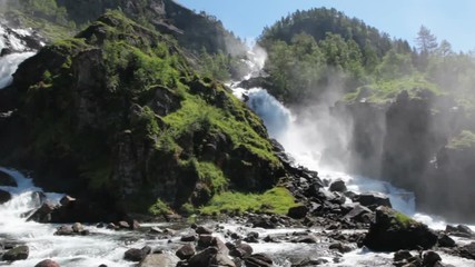 Wall Mural - Latefoss or Latefossen consists of two separate streams flowing down. It is located on Norwegian National Road 13, Odda, Hordaland county, Norway