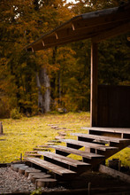 Wooden Staircase To The Veranda In Autumn