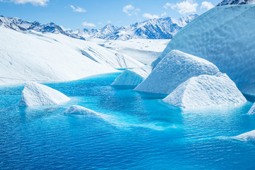 Canyons of ice flooded with bright blue ice of the melting Matanuska Glacier.