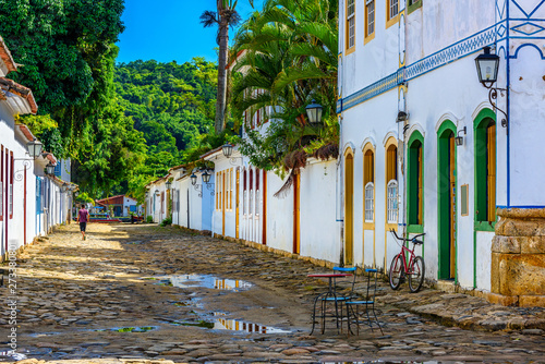 Street with tables of cafe in historical center in Paraty, Rio de Janeiro, Br...