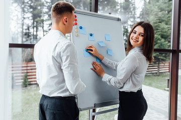 Wall Mural - Professional male and female business partners having meeting to discuss planning strategy for common startup project thinking about attracting investors and sponsors to increase cash budget ..