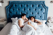 © Тарас Нагирняк - People, rest and relationships concept - happy couple sleeping in bed at home..