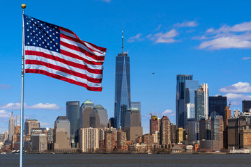 Fototapete - Scene of Flag of America over New york cityscape river side which location is lower manhattan,Architecture and building with tourist and Independence day concept