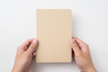 Wall Mural - man hand hold hardcover kraft notebook