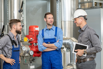  boss with two worker in conversation