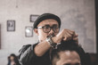 Portrait of barber hairstyle a costumer hair with hand and pomade in barbershop or salon