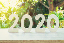New Year Concept : Wooden Number 2020 For New Year On Wood Table With Sunlight.