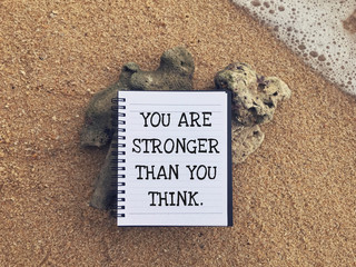 Wall Mural - Motivational and inspirational wording - You Are Stronger Than You Think written on a notebook.