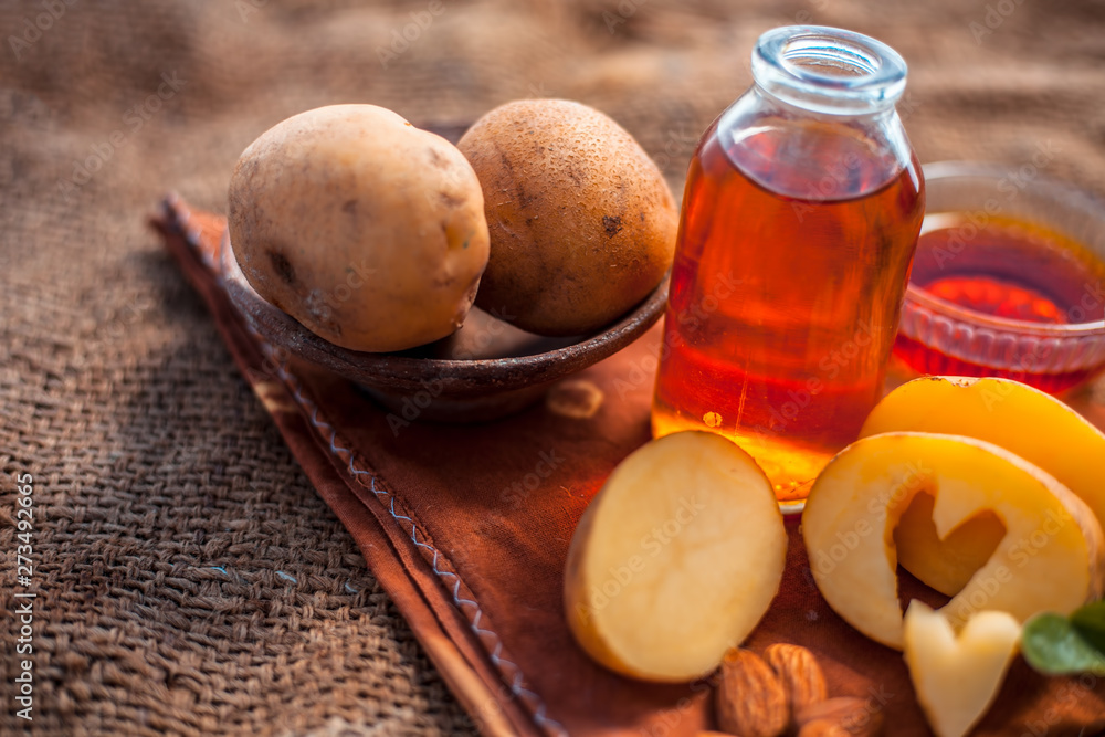 Glowing face mask of potato juice in a glass bowl on brown colored surface  along with some Potato juice,honey and almond oil.Horizontal shot.To  eliminate skin rashes, remove impurities,etc. Stock Photo | Adobe
