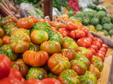 Fototapeta Kuchnia - several types of tomatoes and vegetables on the shelf of a fruit store