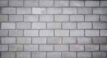 High Resolution Full Frame Background Of A Wall Or Building Exterior Made Of Light Gray Concrete Blocks. Vignette And Copy Space.
