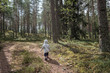 © Martins Vanags - little baby alone wandering in forest
