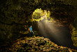 Cave in the Azores with backpacker