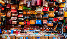 Colorful Leather Purses, Handbags, Wallets And Handbags Are Displayed By Street Vendors At An Outdoor Market, In Florence, Italy.