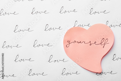 Fotomural Composition with words LOVE YOURSELF and paper heart on white background, top vi
