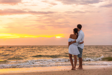 honeymoon couple walking on sunset romantic stroll on lover's key beach in florida enjoying evening 