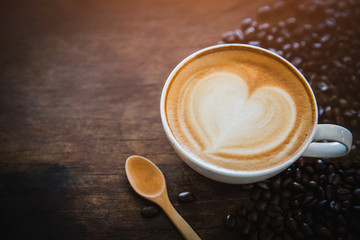 coffee latte with coffee beans  on dark background, top view