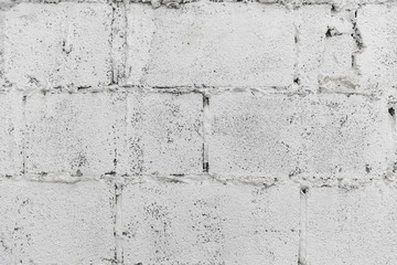 Wall Mural - closeup of white decay brick wall abstract background wallpaper or web banner with copy space.