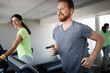 © NDABCREATIVITY - People running on a treadmill in health club