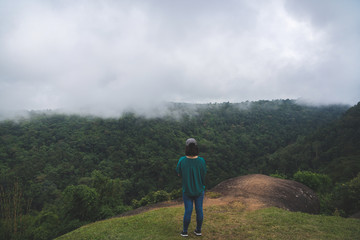 Young girl hipster backpack women travelling looking at beautiful sky mountains scenery views 