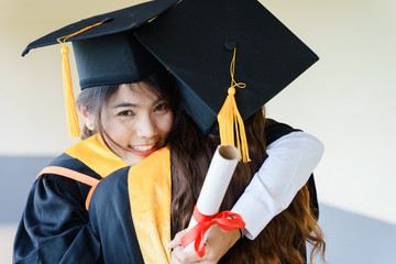 Poster - Female university graduates celebrate happily after completed and received diploma degree. The female graduates express congratulations with each other.