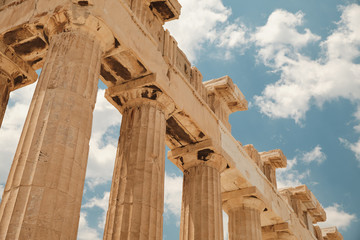 view from below of the temple in the Acropolis area in a sunny day in the capital of Greece - Athens - travel destination concept