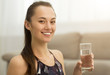 © Prostock-studio - Healthcare. Girl drinking clean mineral water, side view