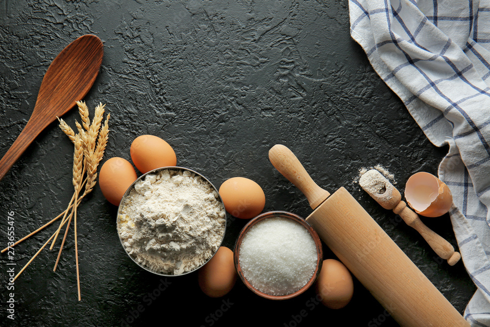 Flour with products on dark background