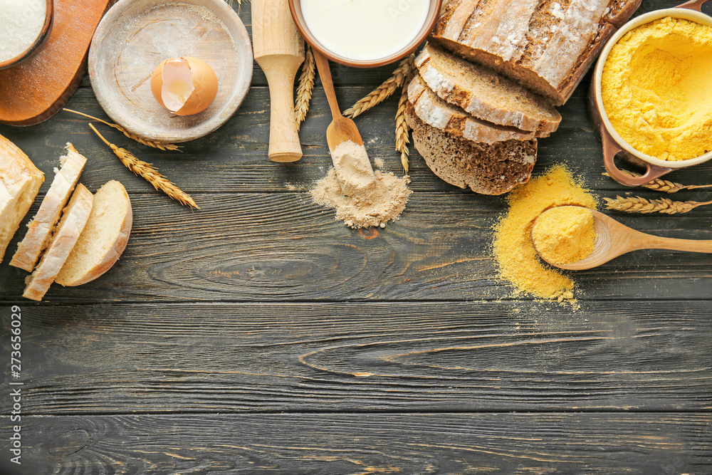 Flour with products on wooden table
