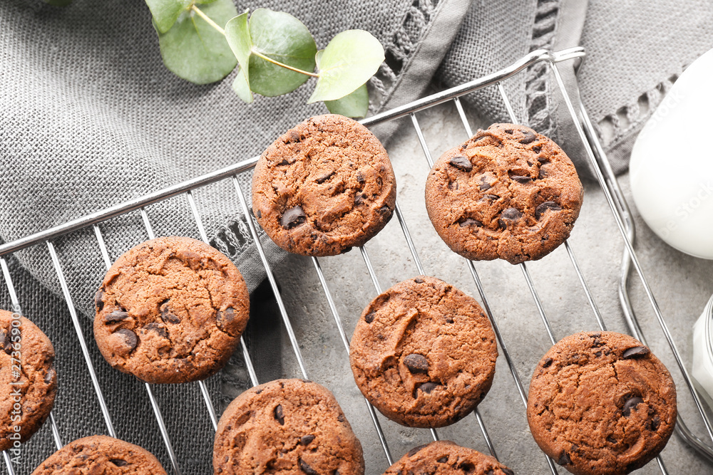 Tasty chocolate cookies on cooling rack