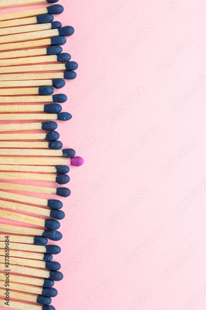 Matches on color background. Concept of uniqueness