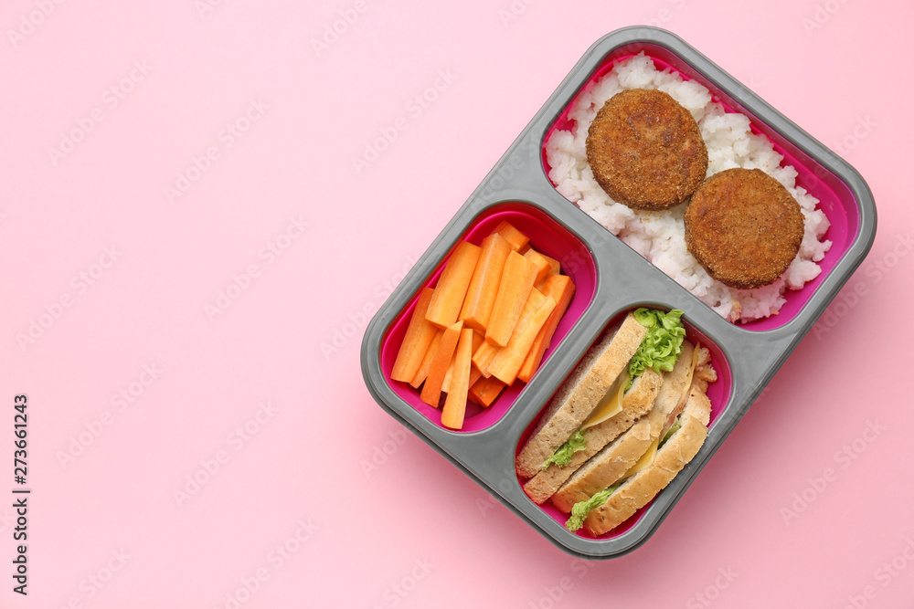 Lunch box with tasty food on color background