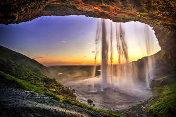 seljalandfoss from behind cave interior, iceland