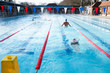 Swimmers compete in the London Fields aquathlon