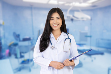 Smiling Asian female doctor work at hospital giving patient convenience online service advice, smiling write a prescription order medical , health care, preventing disease concept.