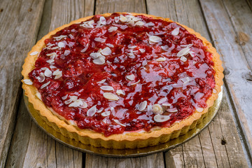 Wall Mural - berry pie on wooden background