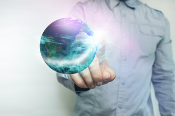 Poster - Human touching planet with finger on a white background. Mixed media.