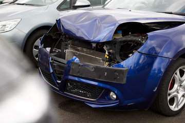 Wall Mural - Detail Of Car Damaged In Motor Vehicle Accident Parked In Garage Repair Shop