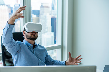 Man gesturing while using VR headset